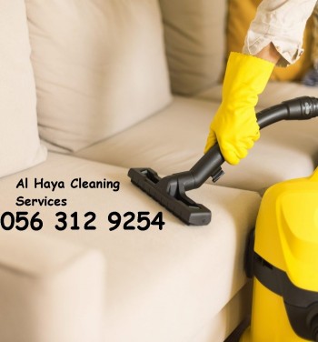 man-cleaning-sofa-with-yellow-vacuum-cleaner-dubai-0563129254